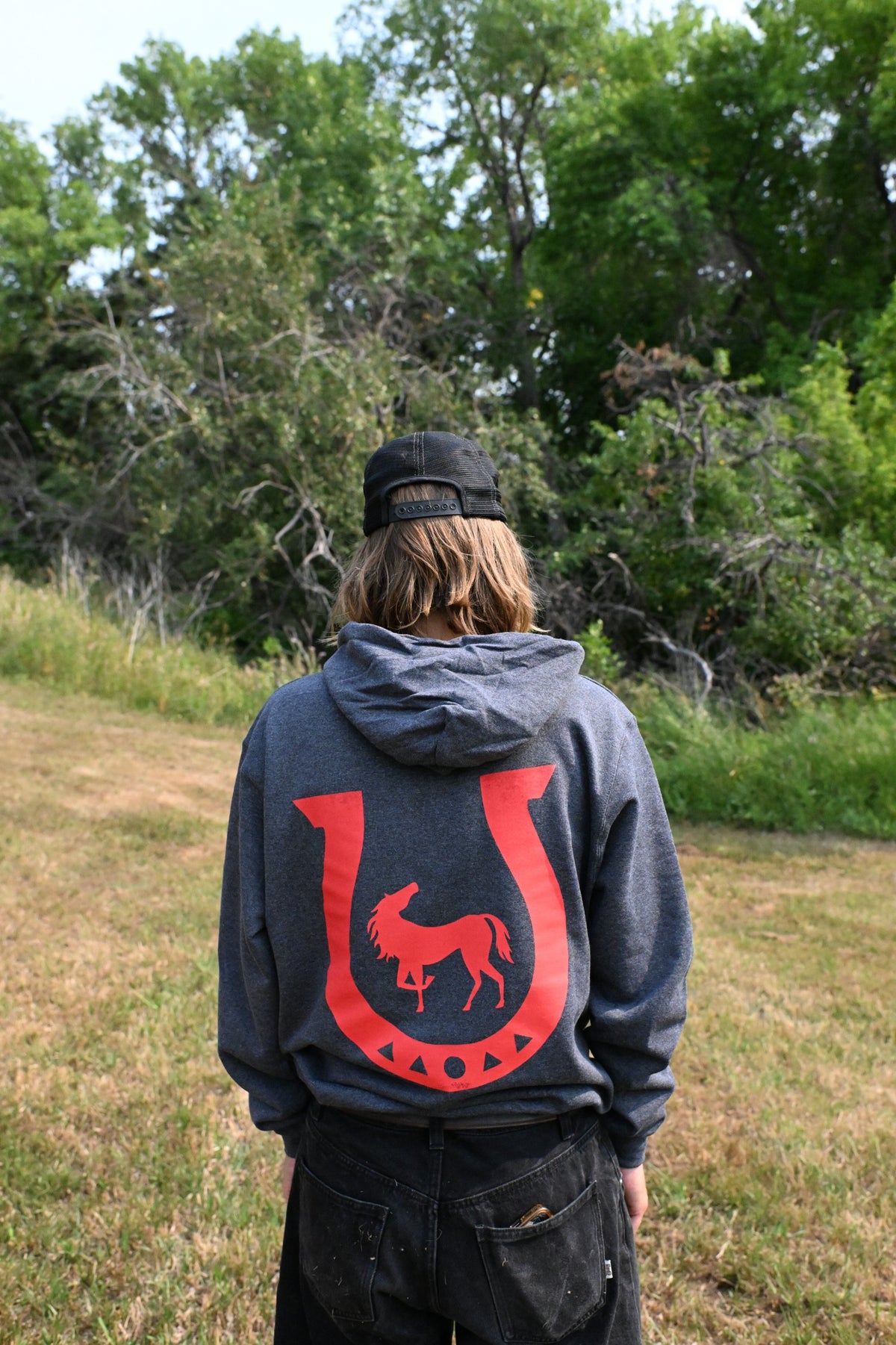 Horseshoe Champion Hoodie, back: red horseshoe with a horse inside